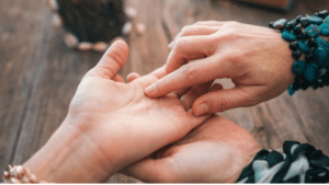 Palm reading showing the major lines on a hand and their traditional meanings in palmistry.